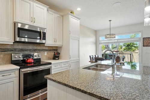 57 Evansglen Mews Nw, Calgary, AB - Indoor Photo Showing Kitchen With Stainless Steel Kitchen With Double Sink With Upgraded Kitchen