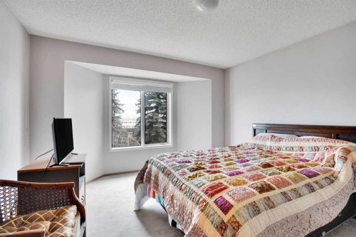 60 Douglas Woods Terrace Se, Calgary, AB - Indoor Photo Showing Bedroom