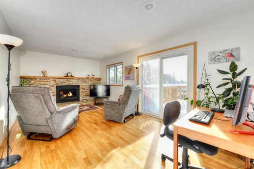 104 Dalgleish Bay Nw, Calgary, AB - Indoor With Fireplace