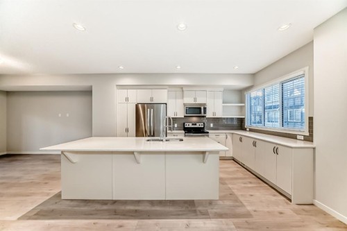 409 Nolanlake Villas Nw, Calgary, AB - Indoor Photo Showing Kitchen With Stainless Steel Kitchen With Double Sink With Upgraded Kitchen