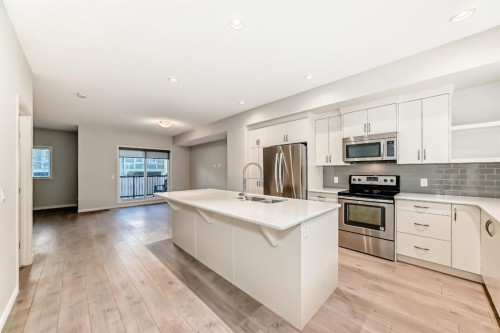 409 Nolanlake Villas Nw, Calgary, AB - Indoor Photo Showing Kitchen With Stainless Steel Kitchen With Double Sink With Upgraded Kitchen