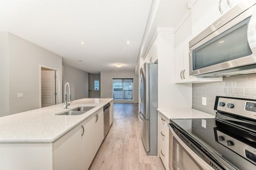 409 Nolanlake Villas Nw, Calgary, AB - Indoor Photo Showing Kitchen With Stainless Steel Kitchen With Double Sink With Upgraded Kitchen