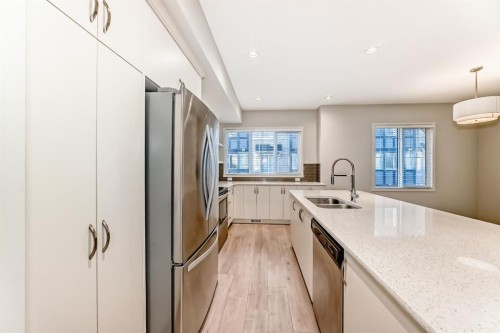 409 Nolanlake Villas Nw, Calgary, AB - Indoor Photo Showing Kitchen With Stainless Steel Kitchen With Double Sink With Upgraded Kitchen
