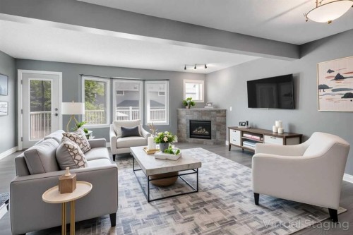 378 Regal Park Ne, Calgary, AB - Indoor Photo Showing Living Room With Fireplace