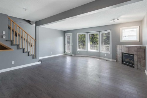 378 Regal Park Ne, Calgary, AB - Indoor Photo Showing Living Room With Fireplace