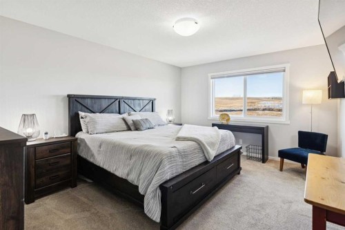 57 Crestridge Bay Sw, Calgary, AB - Indoor Photo Showing Bedroom