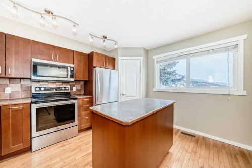 28-800 Bowcroft Place, Cochrane, AB - Indoor Photo Showing Kitchen With Stainless Steel Kitchen