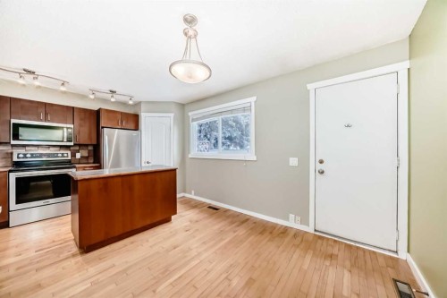 28-800 Bowcroft Place, Cochrane, AB - Indoor Photo Showing Kitchen With Stainless Steel Kitchen