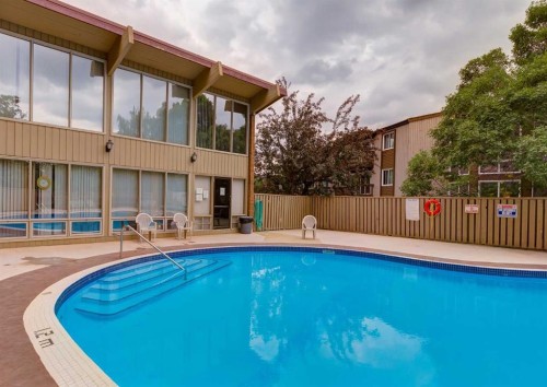 492-8948 Elbow Drive Sw, Calgary, AB - Outdoor With In Ground Pool