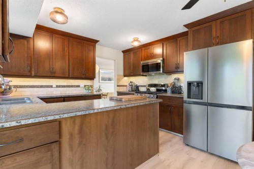 9308 26 Street Sw, Calgary, AB - Indoor Photo Showing Kitchen With Stainless Steel Kitchen With Double Sink