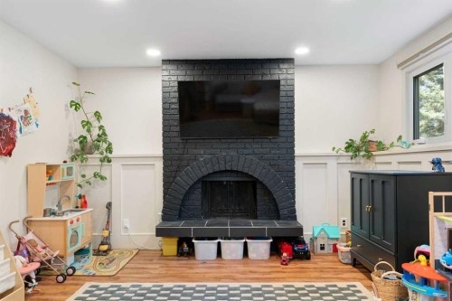 9308 26 Street Sw, Calgary, AB - Indoor Photo Showing Living Room With Fireplace