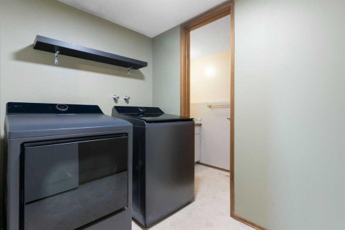 9308 26 Street Sw, Calgary, AB - Indoor Photo Showing Laundry Room