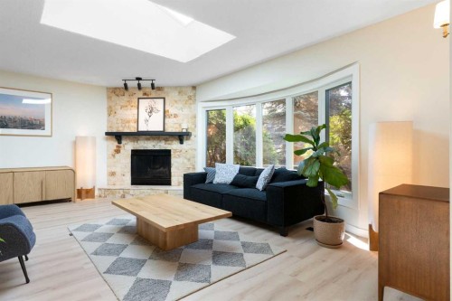 9308 26 Street Sw, Calgary, AB - Indoor Photo Showing Living Room With Fireplace