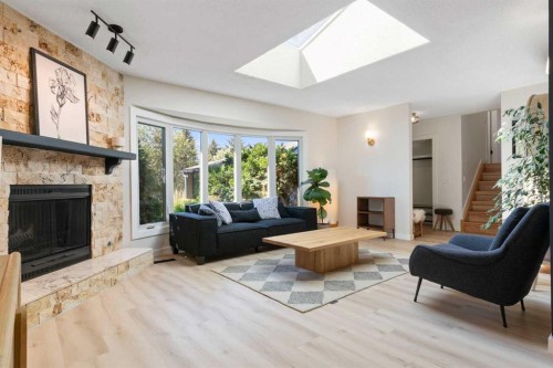 9308 26 Street Sw, Calgary, AB - Indoor Photo Showing Living Room With Fireplace