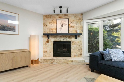 9308 26 Street Sw, Calgary, AB - Indoor Photo Showing Living Room With Fireplace