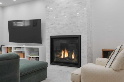 1571 Windsor Street Nw, Calgary, AB - Indoor Photo Showing Living Room With Fireplace