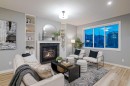 957 West Lakeview Drive, Chestermere, AB  - Indoor Photo Showing Living Room With Fireplace 