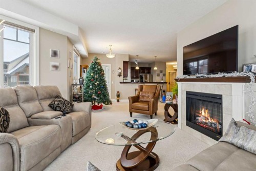 2308-2330 Fish Creek Boulevard Sw, Calgary, AB - Indoor Photo Showing Living Room With Fireplace