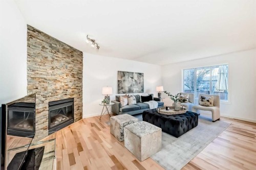 117 Chapalina Close Se, Calgary, AB - Indoor Photo Showing Living Room With Fireplace