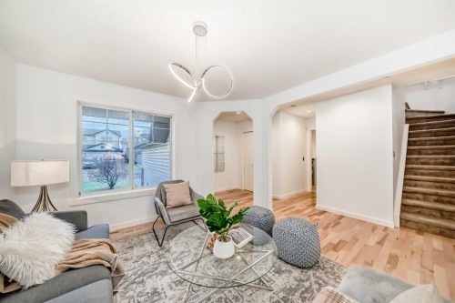 117 Chapalina Close Se, Calgary, AB - Indoor Photo Showing Living Room