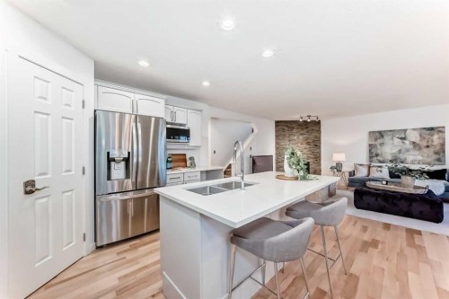 117 Chapalina Close Se, Calgary, AB - Indoor Photo Showing Kitchen With Double Sink