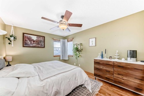 203 Hidden Spring Green Nw, Calgary, AB - Indoor Photo Showing Bedroom