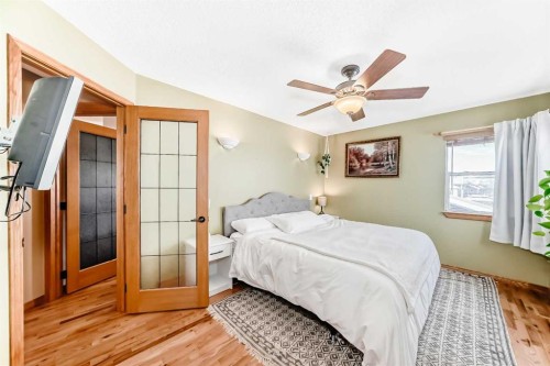 203 Hidden Spring Green Nw, Calgary, AB - Indoor Photo Showing Bedroom