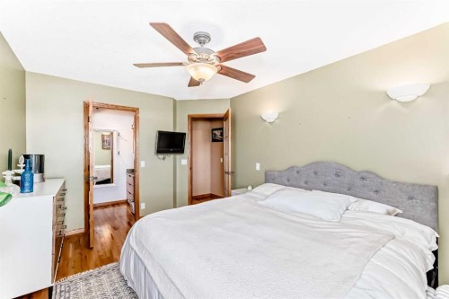 203 Hidden Spring Green Nw, Calgary, AB - Indoor Photo Showing Bedroom