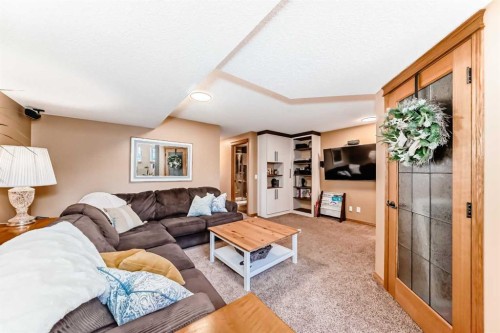 203 Hidden Spring Green Nw, Calgary, AB - Indoor Photo Showing Living Room