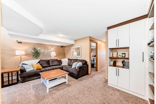 203 Hidden Spring Green Nw, Calgary, AB - Indoor Photo Showing Living Room