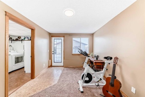 203 Hidden Spring Green Nw, Calgary, AB - Indoor Photo Showing Gym Room