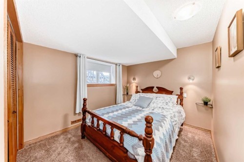 203 Hidden Spring Green Nw, Calgary, AB - Indoor Photo Showing Bedroom