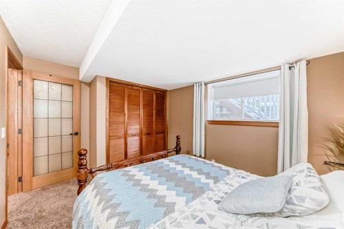 203 Hidden Spring Green Nw, Calgary, AB - Indoor Photo Showing Bedroom