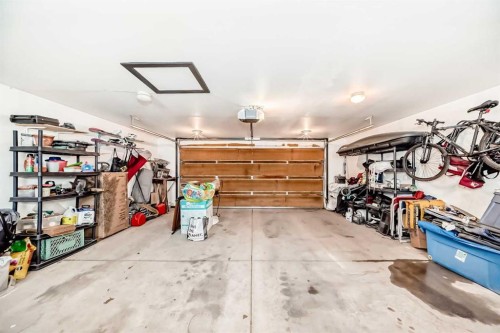 203 Hidden Spring Green Nw, Calgary, AB - Indoor Photo Showing Garage