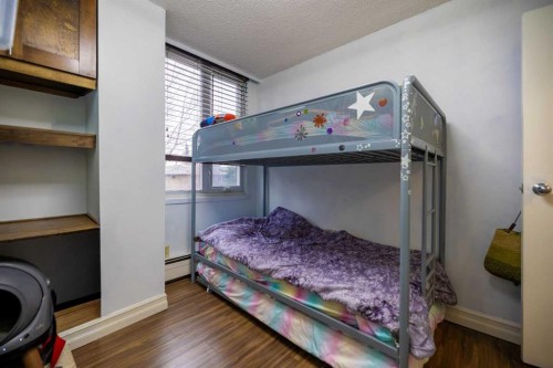 208-4944 Dalton Drive Nw, Calgary, AB - Indoor Photo Showing Bedroom