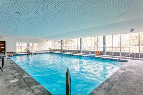 208-4944 Dalton Drive Nw, Calgary, AB -  With In Ground Pool