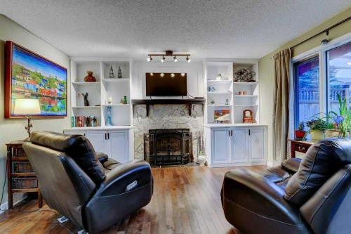 28 Hawktree Circle Nw, Calgary, AB - Indoor Photo Showing Living Room With Fireplace