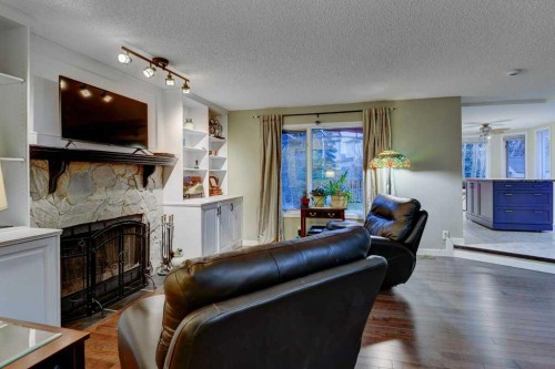 28 Hawktree Circle Nw, Calgary, AB - Indoor Photo Showing Living Room With Fireplace