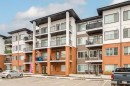 3201-6 Merganser, Chestermere, AB  - Outdoor With Balcony With Facade 