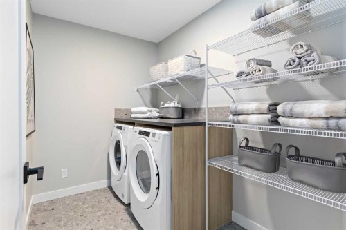 8 Creekview Manor Sw, Calgary, AB - Indoor Photo Showing Laundry Room