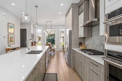 2432 32 Street Sw, Calgary, AB - Indoor Photo Showing Kitchen With Double Sink With Upgraded Kitchen
