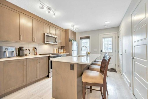413-338 Seton Circle Se, Calgary, AB - Indoor Photo Showing Kitchen With Upgraded Kitchen