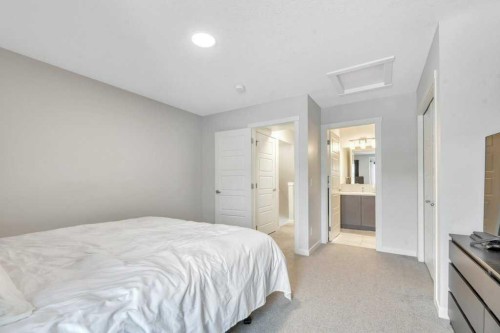 413-338 Seton Circle Se, Calgary, AB - Indoor Photo Showing Bedroom