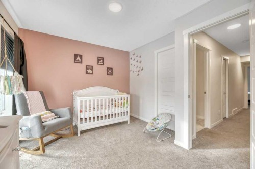 413-338 Seton Circle Se, Calgary, AB - Indoor Photo Showing Bedroom