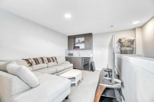 413-338 Seton Circle Se, Calgary, AB - Indoor Photo Showing Living Room
