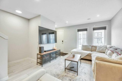 413-338 Seton Circle Se, Calgary, AB - Indoor Photo Showing Living Room