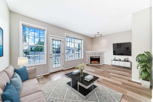 84 Inverness Square Se, Calgary, AB - Indoor Photo Showing Living Room With Fireplace