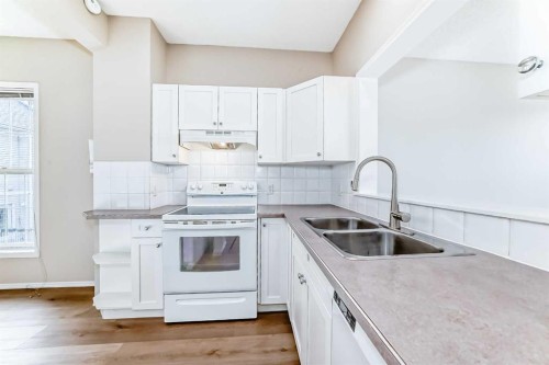 84 Inverness Square Se, Calgary, AB - Indoor Photo Showing Kitchen With Double Sink