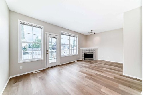 84 Inverness Square Se, Calgary, AB - Indoor Photo Showing Living Room With Fireplace