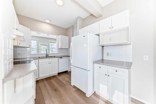84 Inverness Square Se, Calgary, AB - Indoor Photo Showing Kitchen With Double Sink